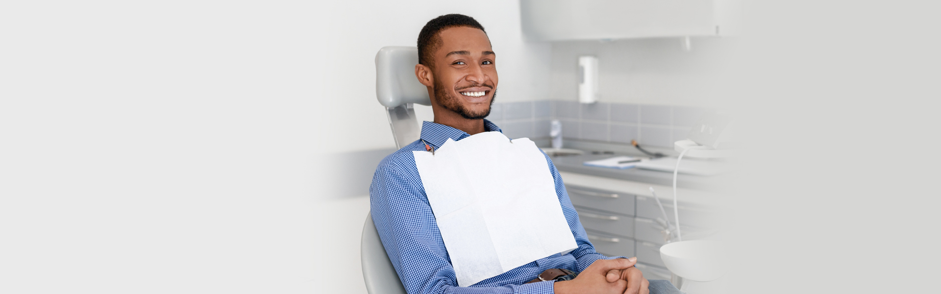 A man smiling after getting a bone graft treatment